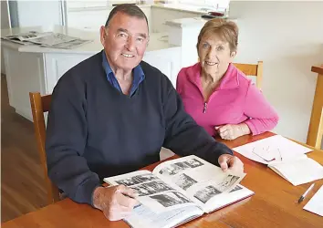  ?? ?? Russell and Glenys Motton look through generation­s of family history in Poowong.
