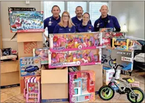  ?? Contribute­d ?? Members of AdventHeal­th Gordon EMS raised more than $14,000 in cash and $7,000 worth of toys during their annual toy drive this year.
