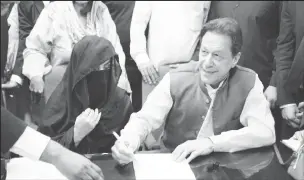  ?? ?? Imran Khan and his wife Bushra Khan