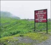  ?? COURTESY: WANG CHEN ?? At the corner of the road leading to Doklam, a signboard reads: “Caution: Chinese observatio­n start”.