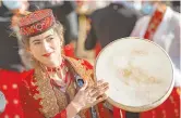  ??  ?? An actress in the Taxkorgan Tajik Autonomous County of the Xinjiang Uygur Autonomous Region. — Xinhua