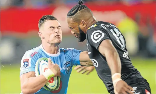  ?? Picture: LEE WARREN/GALLO IMAGES ?? BRUISING ENCOUNTER: Jesse Kriel, of the Bulls, and Lukhanyo Am, of the Sharks, during the Super Rugby match at the Loftus Versfeld Stadium in Pretoria on Saturday