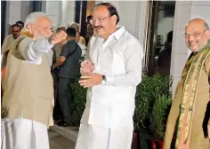  ??  ?? Prime Minister Narendra Modi with Venkaiah Naidu and BJP president Amit Shah in New Delhi on Monday. —DC