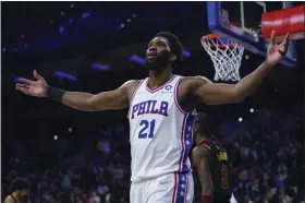  ?? CHRIS SZAGOLA — THE ASSOCIATED PRESS ?? Joel Embiid soaks up the adulation of 76ers fans after a dunk in the second half of Saturday’s 103-93 win over Cleveland at Wells Fargo Center.