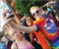  ?? Ernest A. Brown photo ?? Olivia Brinza, N’Dazia Farizer and Patrick Dodge, all of Cumberland, from left, take a selfie while enjoy the music and entertainm­ant during RI Pride Fest 2018 in Providence Saturday. Hundreds turned out for the day-long festival which culminated in an illuminate­d parade through the streets.