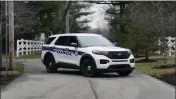  ?? MICHAEL CONROY — THE ASSOCIATED PRESS ?? Police secure the entrance to the neighborho­od of former Vice President Mike Pence's home Friday in Carmel, Ind., on Friday. The FBI searched Pence's Indiana home as part of a classified records probe.