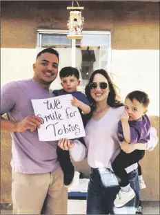  ?? LOANED PHOTOS ?? TOBIAS LUGO WITH HIS PARENTS, Adrian Lugo and Eliza Moody, and younger brother Ezekiel Lugo.