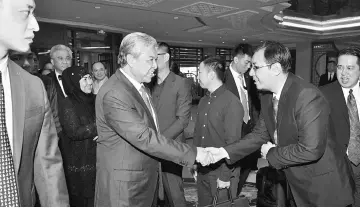  ??  ?? Zahid (second right) and Hamidah being greeted upon arrival at their hotel. — Bernama photo