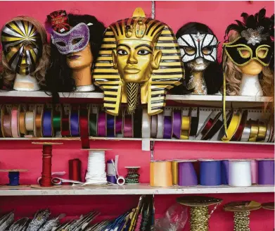  ?? Photos by Mark Mulligan / Staff photograph­er ?? Masks and ribbons are for sale on a wall at Southern Importers. The Houston novelty shop has been in its current space on San Jacinto in the Museum District since the late 1960s but is closing Saturday.