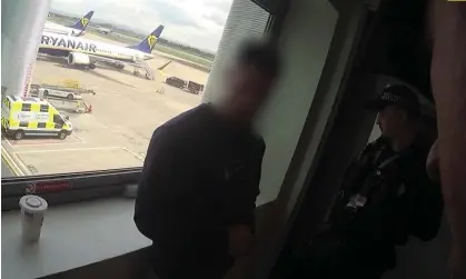  ?? Photograph: Metropolit­an Police/PA ?? An alleged LabHost scammer is arrested at a UK airport. Police detained 37 suspects connected to the dark web site.