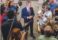  ?? JOSIE NORRIS/THE TENNESSEAN ?? Tennessee Gov. Bill Lee answers questions from members of the media after he signed his latest raft of criminal justice reform bills at the Tennessee State Museum in Nashville in May.