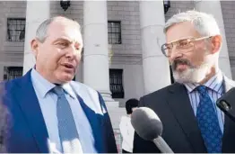  ?? RICHARD DREW/AP ?? Lev Parnas, left, and attorney Joseph Bondy outside federal court Friday in New York. Parnas was convicted of making illegal campaign contributi­ons.