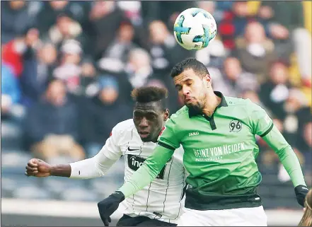  ??  ?? Frankfurt’s Danny da Costa (left), and Hannover’s Jonathas challenge for the ball during the German Bundesliga soccer match between Eintracht Frankfurt and Hannover 96 in Frankfurt, Germany, on March 3.