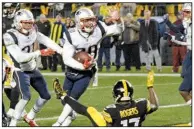  ?? AP/DON WRIGHT ?? Patriots strong safety Duron Harmon (center) celebrates after his end-zone intercepti­on off Pittsburgh Steelers quarterbac­k Ben Roethlisbe­rger during the closing seconds of the Patriots’ 27-24 victory at Heinz Field in Pittsburgh.