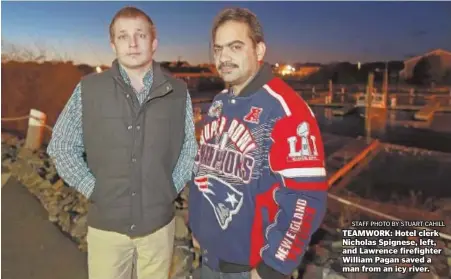  ?? STAFF PHOTO BY STUART CAHILL ?? TEAMWORK: Hotel clerk Nicholas Spignese, left, and Lawrence firefighte­r William Pagan saved a man from an icy river.