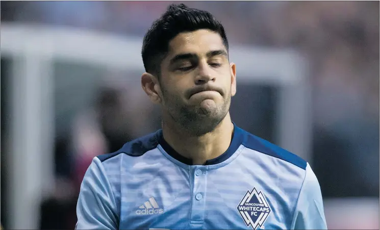  ?? — THE CANADIAN PRESS ?? Vancouver’s Matias Laba leaves the field dejectedly after receiving a red card during the first half of Saturday’s game against the Galaxy at B.C. Place.