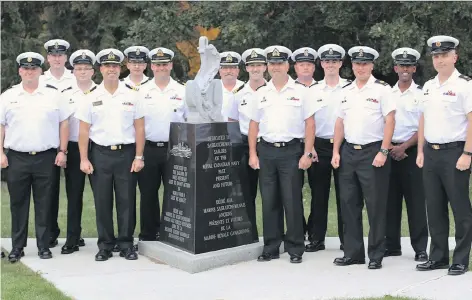  ?? HMCS REGINA ?? Crew members from Her Majesty’s Canadian Ship Regina gather around the Naval Memorial at HMCS Queen on Thursday. The group flew to Regina this weekend to visit the namesake city of their warship and will take in Roughrider­s and Pats games while they...