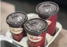  ?? THE CANADIAN PRESS ?? Tim Hortons has added another weapon to its arsenal in the coffee wars by coming out with Three Peaks Colombian.