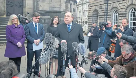  ?? Picture: PA. ?? Alex Salmond, watched by, from left, former Scottish Parliament presiding officer Tricia Marwick, solicitor David Mckie and solicitor Beverley Atkinson, speaking outside the Court of Session in Edinburgh.