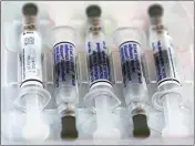  ?? DAMIAN DOVARGANES — THE ASSOCIATED PRESS ?? Vaccine syringes