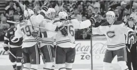  ?? BRIAN BLANCO/ THE ASSOCIATED PRESS ?? Montreal’s Andrei Markov, left, Lars Eller, Travis Moen, P.K. Subban and Colby Armstrong celebrate Subban’s goal during the second period against Tampa Bay on Tuesday night.