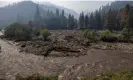  ?? David McNew/AFP/Getty Images ?? The Klamath River runs brown with mud after flash floods hit the McKinney fire. Photograph: