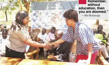  ??  ?? Kalumbila District Education Board Secretary Mutinta Mubanga (right) greets Kalumbila Minerals Limited public relations coordinato­r Mirriam Harmon during the hand over ceremony.