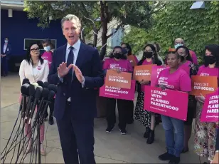  ?? MICHAEL R. BLOOD — THE ASSOCIATED PRESS ?? California Gov. Gavin Newsom talks at a news conference with workers and volunteers on Wednesday, May 4, 2022, at a Planned Parenthood office near downtown Los Angeles.