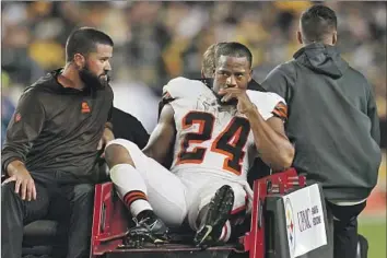  ?? Matt Freed Associated Press ?? NICK CHUBB is carted off the field after the Browns running back suffered a season-ending knee injury in Monday’s 26-22 loss to the Steelers. Chubb will need surgery on the same knee he had reconstruc­ted in 2015.