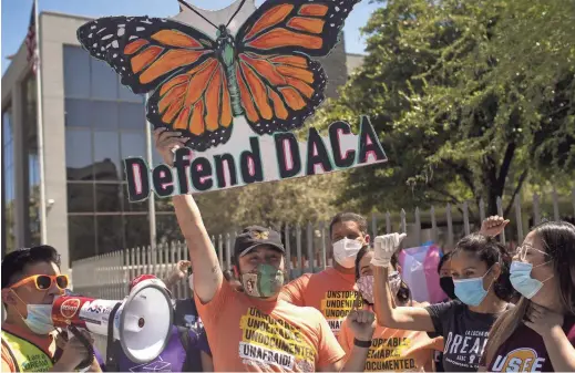  ?? PHOTOS BY THOMAS HAWTHORNE/THE REPUBLIC ?? DACA recipients and advocates rally in support of the U.S. Supreme Court ruling on the Deferred Action for Childhood Arrivals program outside of the U.S. Immigratio­n and Customs Enforcemen­t headquarte­rs in Phoenix on Thursday.