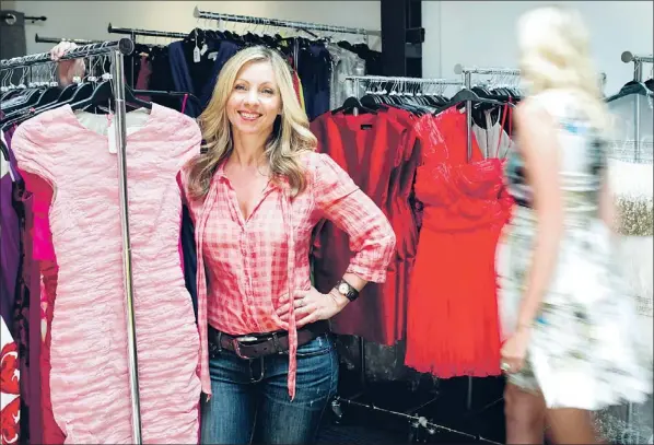  ?? — Photo by The Canadian Press/chris Young ?? Kristy Wieber, president and co-founder of Rent Frock Repeat, stands in the company’s studio in Toronto on Tuesday, July 10.