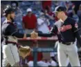  ?? CHRIS CARLSON — ASSOCIATED PRESS ?? Indians catcher Yan Gomes, left, celebrates with relief pitcher Tyler Olson after beating the Angels on Sept. 21 in Anaheim, Calif.