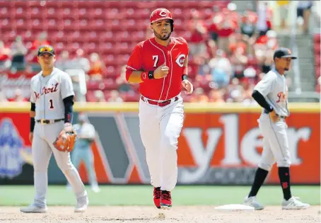  ?? JOHN MINCHILLO/THE ASSOCIATED PRESS ?? Cincinnati Reds third baseman Eugenio Suarez hit the second of back-to-back homers off Detroit Tigers starter Michael Fulmer in the sixth inning Wednesday as the Ohio hosts won 5-3 at Great American Ball Park.