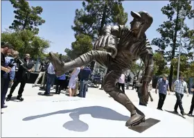  ?? KEITH BIRMINGHAM — THE ORANGE COUNTY REGISTER VIA AP ?? The Los Angeles Dodgers unveil a Sandy Koufax statue in the Centerfiel­d Plaza to honor the Hall of Famer and three-time Cy Young Award winner prior to a game between the Cleveland Guardians and the Dodgers at Dodger Stadium in Los Angeles on Saturday.