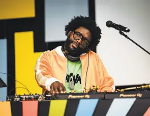  ?? Searchligh­t Pictures ?? The Roots and “Tonight Show” bandleader Ahmir “Questlove” Thompson makes his directoria­l debut with “Summer of Soul.”