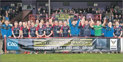  ?? Photograph: Neil Paterson. ?? A jubilant Scotland squad celebrate after their 14-5 win over Ireland in October to lift the Marine Harvest Quaich.