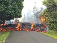 ?? Photo courtesy U.S. Geological Survey ?? A lava flow moves down a residentia­l street in Hawaii on May 6.