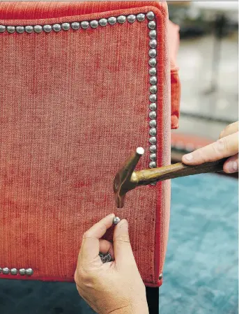  ?? ETHAN ALLEN ?? A custom nailhead trim is applied to Ethan Allen’s Grace Chair, which is tailored by hand as shown here in their North American workshops. Americans spend billions of dollars a year on furniture, but they’re often not getting what they pay for.