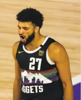  ?? Mike Erhmann / Associated Press ?? Denver’s Jamal Murray is pumped during his 42point performanc­e in the Nuggets’ 117107 playoff win over Utah on Tuesday (Page D3). Both of those teams could be strong contenders in the Western Conference next season.