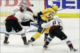  ?? MARK HUMPHREY — THE ASSOCIATED PRESS ?? Nashville Predators left wing Austin Watson (51) scores a goal against Colorado Avalanche goaltender Jonathan Bernier during the third period in Game 2 of an NHL hockey first-round playoff series Saturday in Nashville, Tenn. Avalanche’s Blake Comeau...