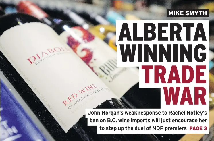  ??  ?? Wine bottles are displayed at an Alberta liquor store. That province banned B.C. wine imports in a growing spat over the Trans Mountain pipeline expansion. — THE CANADIAN PRESS