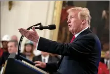  ?? PHOTO/ANDREW ?? In this Thursday file photo, President Donald Trump speaks before signing an Executive Order that establishe­s a National Council for the American Worker during a ceremony in the East Room of the White House in Washington. AP HARNIK