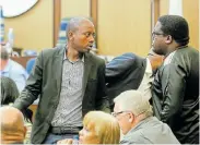  ??  ?? BRIDGING THE DIVIDE: Andile Lungisa of the ANC speaks to DA chief whip Kabelo Mogatosi before the vote on the no-confidence motion