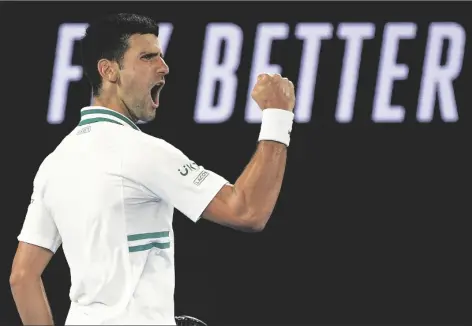  ?? ASSOCIATED PRESS ?? SERBIA’S NOVAK DJOKOVIC reacts after winning a point against Russia’s Daniil Medvedev in the men’s singles final at the Australian Open championsh­ip in Melbourne, Australia, on Sunday.