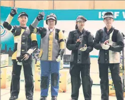  ??  ?? The 10m air rifle mixed team medallists at the Karni Singh Shooting Range.