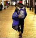  ??  ?? A homeless man walking on Dublin’s Grafton Street