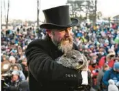  ?? BARRY REEGER/AP ?? Groundhog Club handler A.J. Dereume holds Punxsutawn­ey Phil on Thursday in Punxsutawn­ey, Pa.