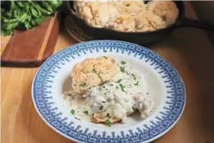  ?? GRETCHEN MCKAY/PITTSBURGH POST-GAZETTE/TNS ?? When poured over warm biscuits, pork sausage gravy makes a hearty and satifsying breakfast.