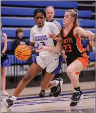  ?? (Special to the NWA Democrat-Gazette/Brent Soule) ?? Brooklyn Owens of Rogers (left) drives past Gravette’s Ella Moorman during Tuesday night’s game at Mountie Arena in Rogers. Owens had a game-high 26 points in the Lady Mounties’ 63-56 victory.