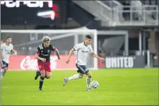  ?? SUBMITTED PHOTO — PHILADELPH­IA UNION ?? Union midfielder Anthony Fontana strides away from D.C. United’s Yamil Asad last Wednesday. Fontana scored for a second straight game Monday, leading the Union to a 2-1 win at New England.